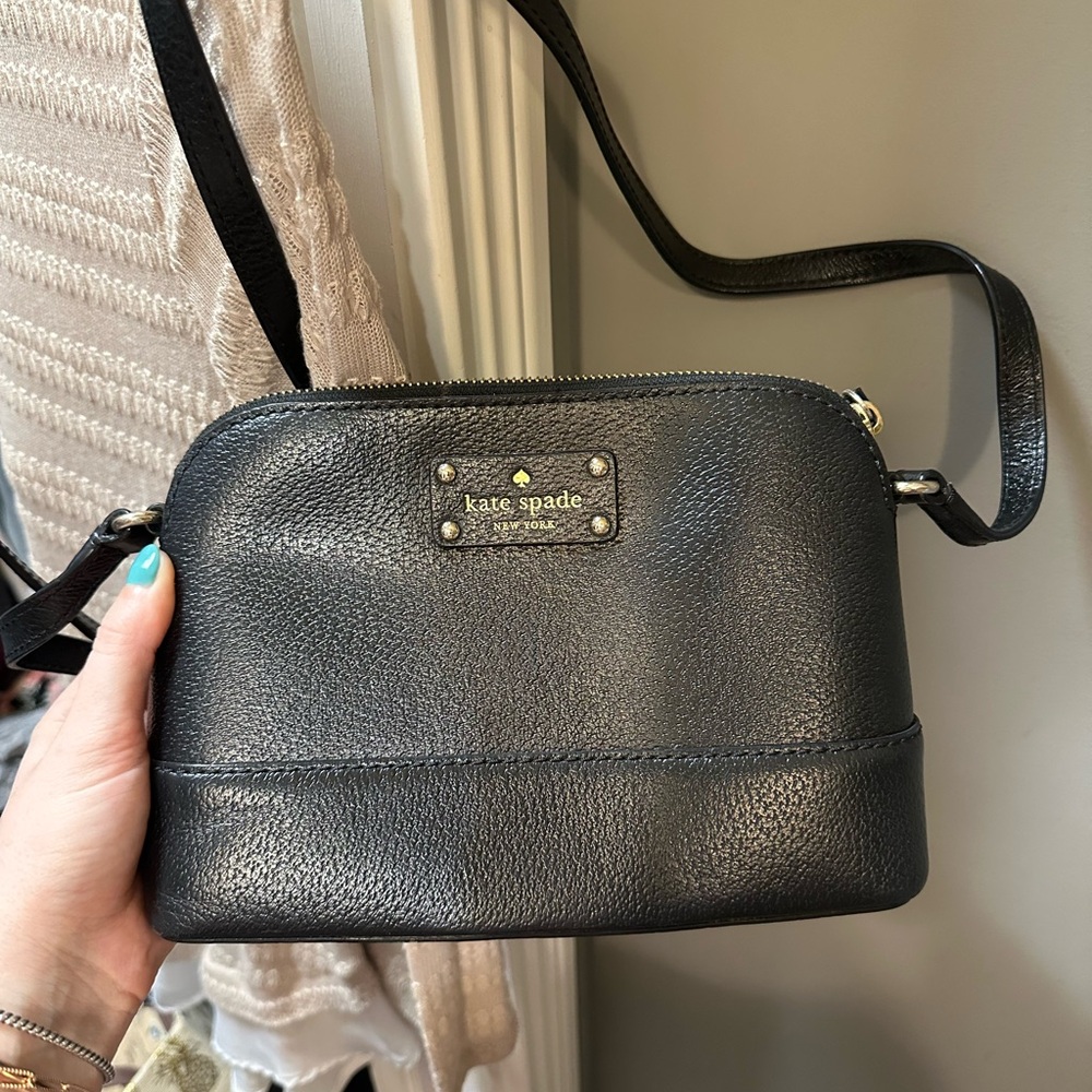 Black Kate Spade adjustable Strap purse. Used few times. Great shape!